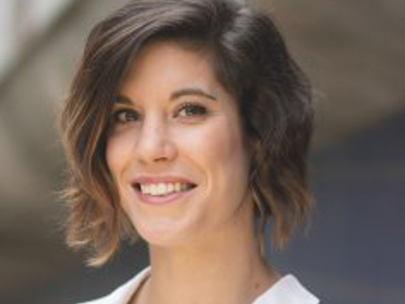 Headshot of Sandrine Monin. White female with short brown hair smiling at the camera